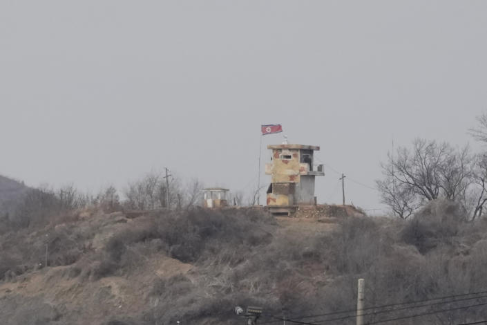 A North Korean flag flutters in the wind at a military guard post seen from Paju, South Korea, Tuesday, March 14, 2023. North Korea test-fired two short-range ballistic missiles in another show of force Tuesday, a day after the United States and South Korea began military drills that Pyongyang views as an invasion rehearsal. (AP Photo/Lee Jin-man)