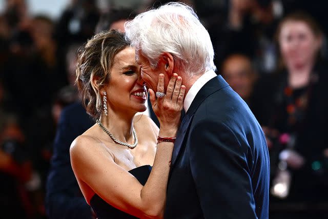 <p>LOIC VENANCE/AFP via Getty</p> Alejandra Silva and Richard Gere share a sweet embrace at the 2024 Cannes Film Festival