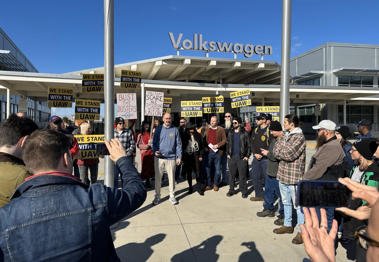 Shawn Fain (center in blue hoodie), president of the UAW, speaks workers and members of Chattanoogans in Action for Love, Equality and Benevolence, a community and faith coalition advocating for economic justice, at the VW plant in Chattanooga, Tenn. on Dec. 18, 2023.