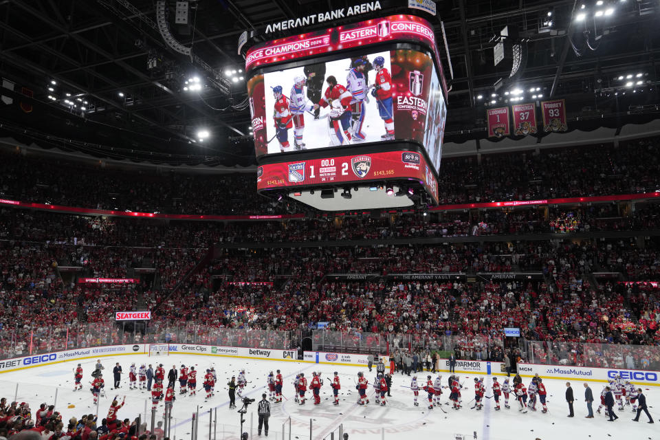 Florida Panthers players shake hands with New York Rangers players after winning Game 6 to win the Eastern Conference finals of the NHL hockey Stanley Cup playoffs Saturday, June 1, 2024, in Sunrise, Fla. (AP Photo/Lynne Sladky)