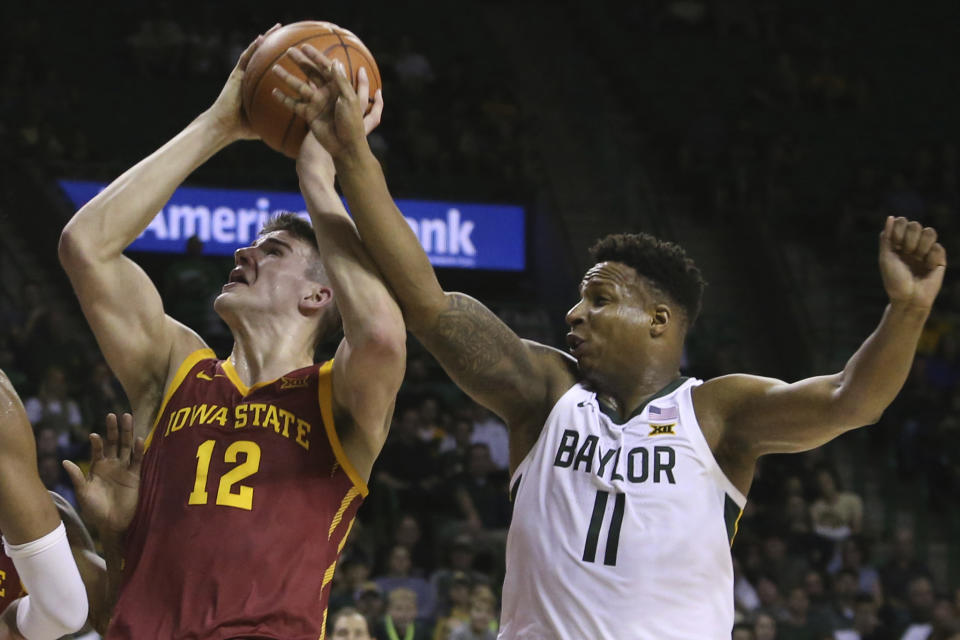 Iowa State forward Michael Jacobson (12) is fouled by Baylor guard Mark Vital (11) during the first half of an NCAA college basketball game Wednesday Jan. 15, 2020, in Waco, Texas. (AP Photo/Jerry Larson)