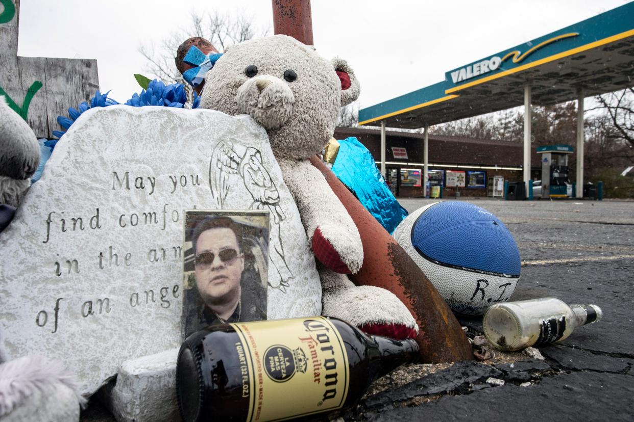 A memorial for Vicente Ramirez in the parking lot of a Valero gas station on Poplar Level Road, 11 months after his murder. Ramirez died in his vehicle at this location after sustaining mortal wounds from being shot in a nearby neighborhood. Nov. 27, 2018