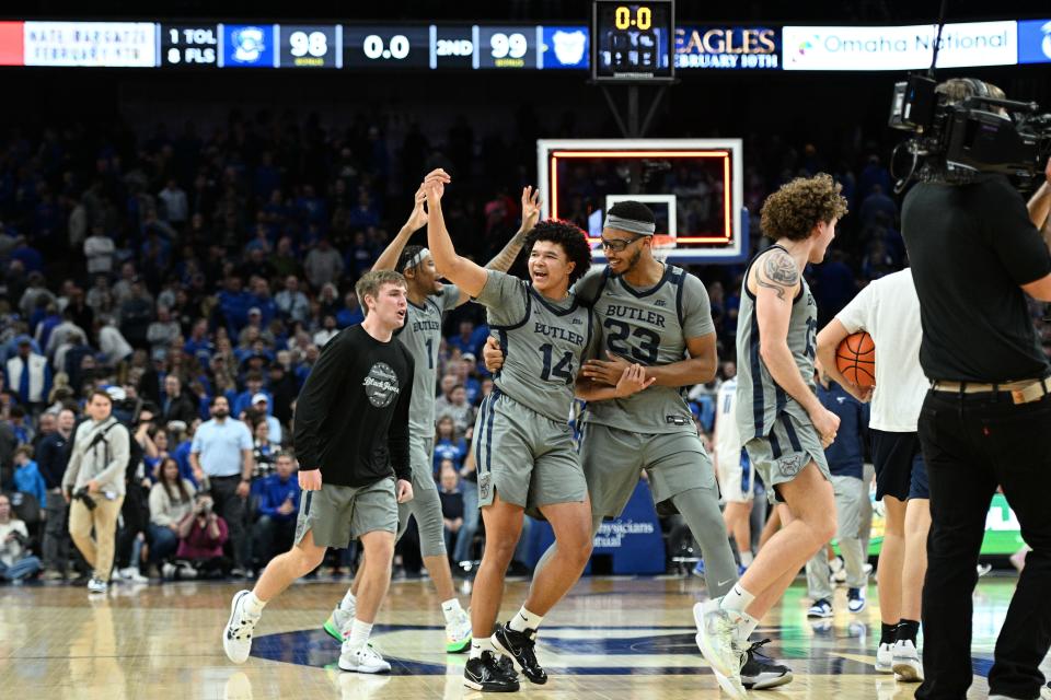 Feb 2, 2024; Omaha, Nebraska, USA; Butler Bulldogs guard Landon Moore (14) and center Andre Screen (23) celebrate the win against the Creighton Bluejays in the second half at CHI Health Center Omaha. Mandatory Credit: Steven Branscombe-USA TODAY Sports