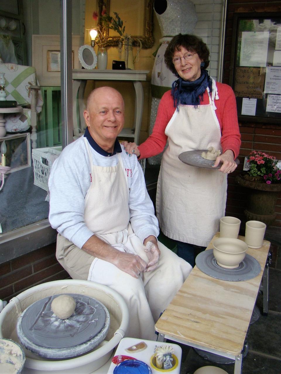 Chuck and Shana Fair demonstrate pottery making outside Ellie's Cottage