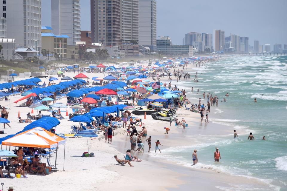 Despite double red flags being posted, the beach was packed Friday near the Russell-Fields Pier in Panama City Beach. Some beachgoers were still in the water, despite it being illegal at that time.