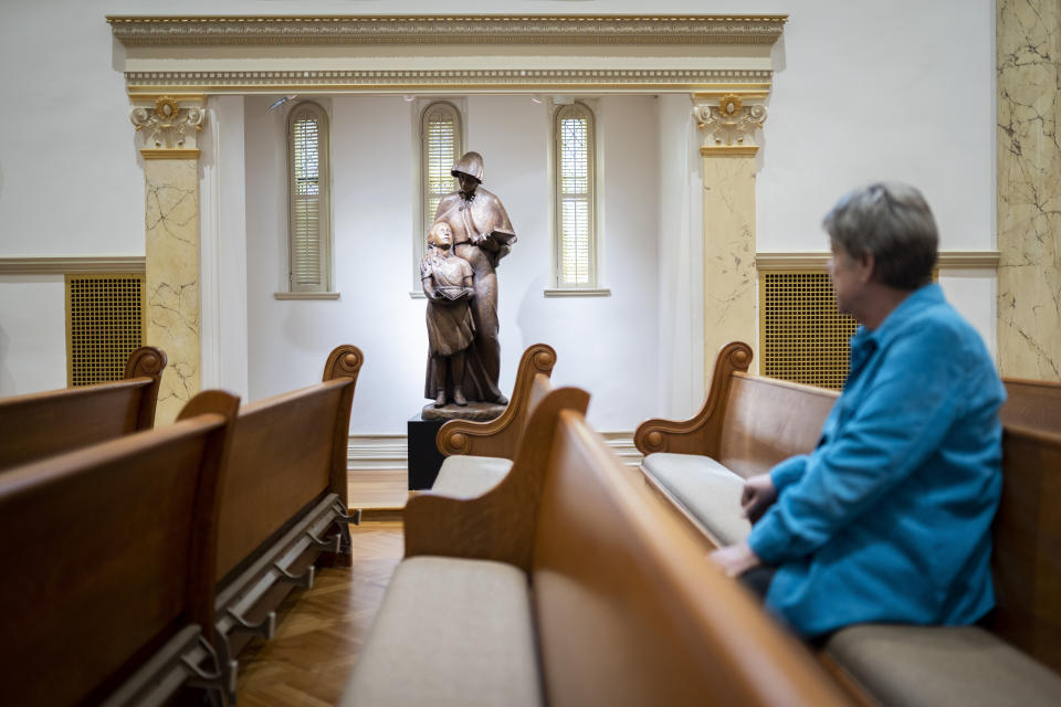 Sister Donna Dodge, a member of the leadership council of the Sisters of Charity, looks at a statue of Saint Elizabeth Ann Seton, the founder of their order, inside the Chapel of the Immaculate Conception where they took their vows at various times, at the College of Mount Saint Vincent, a private Catholic college in the Bronx borough of New York, on Tuesday, May 2, 2023. In more than 200 years of service, the Sisters of Charity of New York have cared for orphans, taught children, nursed the Civil War wounded and joined Civil Rights demonstrations. Last week, the Catholic nuns decided that it will no longer accept new members in the United States and will accept the "path of completion." (AP Photo/John Minchillo)