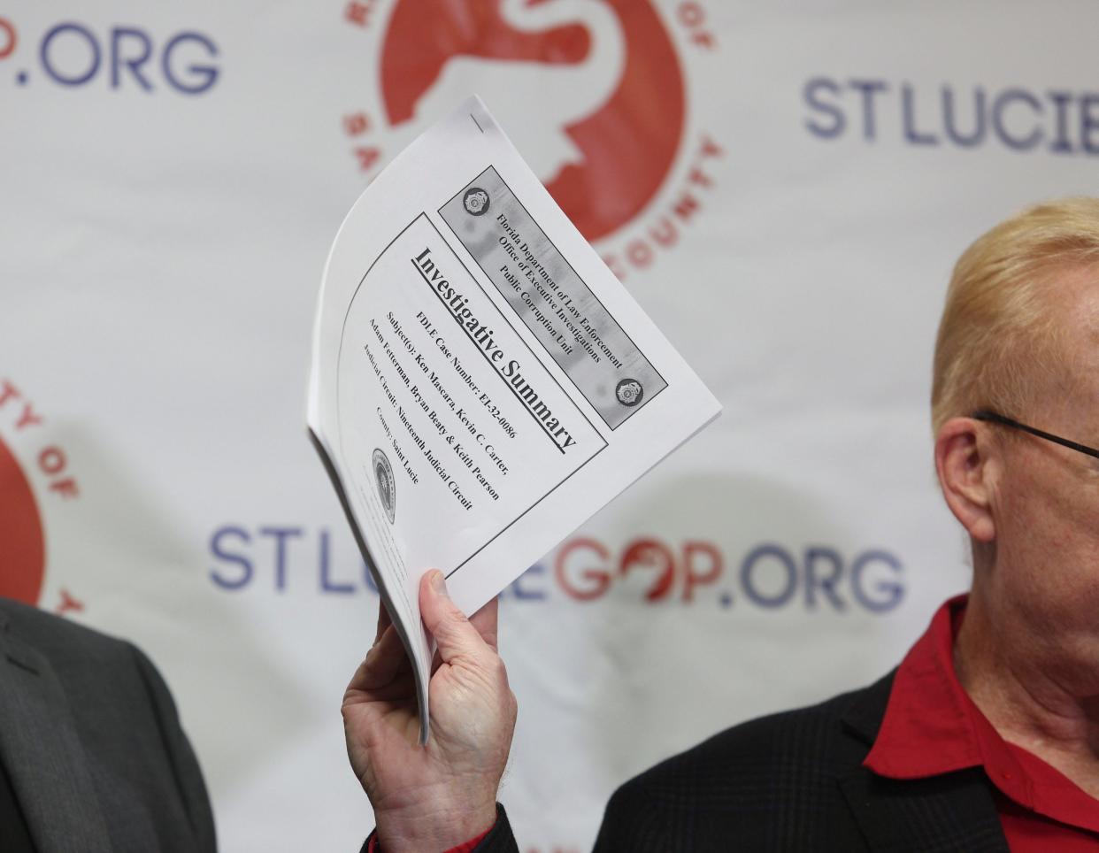 Kenny Nail, chairman of the St. Lucie County Republican Executive Committee, holds a briefing at a St. Lucie County Republican party’s office, Wednesday, Dec. 6, 2023, in Port. St. Lucie. In his hand, he holds a copy of a Florida Department of Law Enforcement report on an alleged "ghost candidate" scheme, for which new Sheriff Keith Pearson was interviewed by investigators.