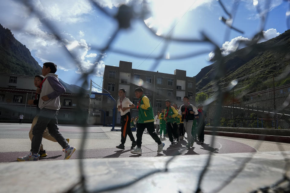 Students attend a physical education class at the Shangri-La Key Boarding School during a media-organized tour in Dabpa county, Kardze Prefecture, Sichuan province, China on Sept. 5, 2023. Village schools have been shuttered across China's Tibet and replaced with centralized boarding schools that critics say represents forced assimilation. Activists estimate 1 million Tibetan children study at such boarding schools. (AP Photo/Andy Wong)