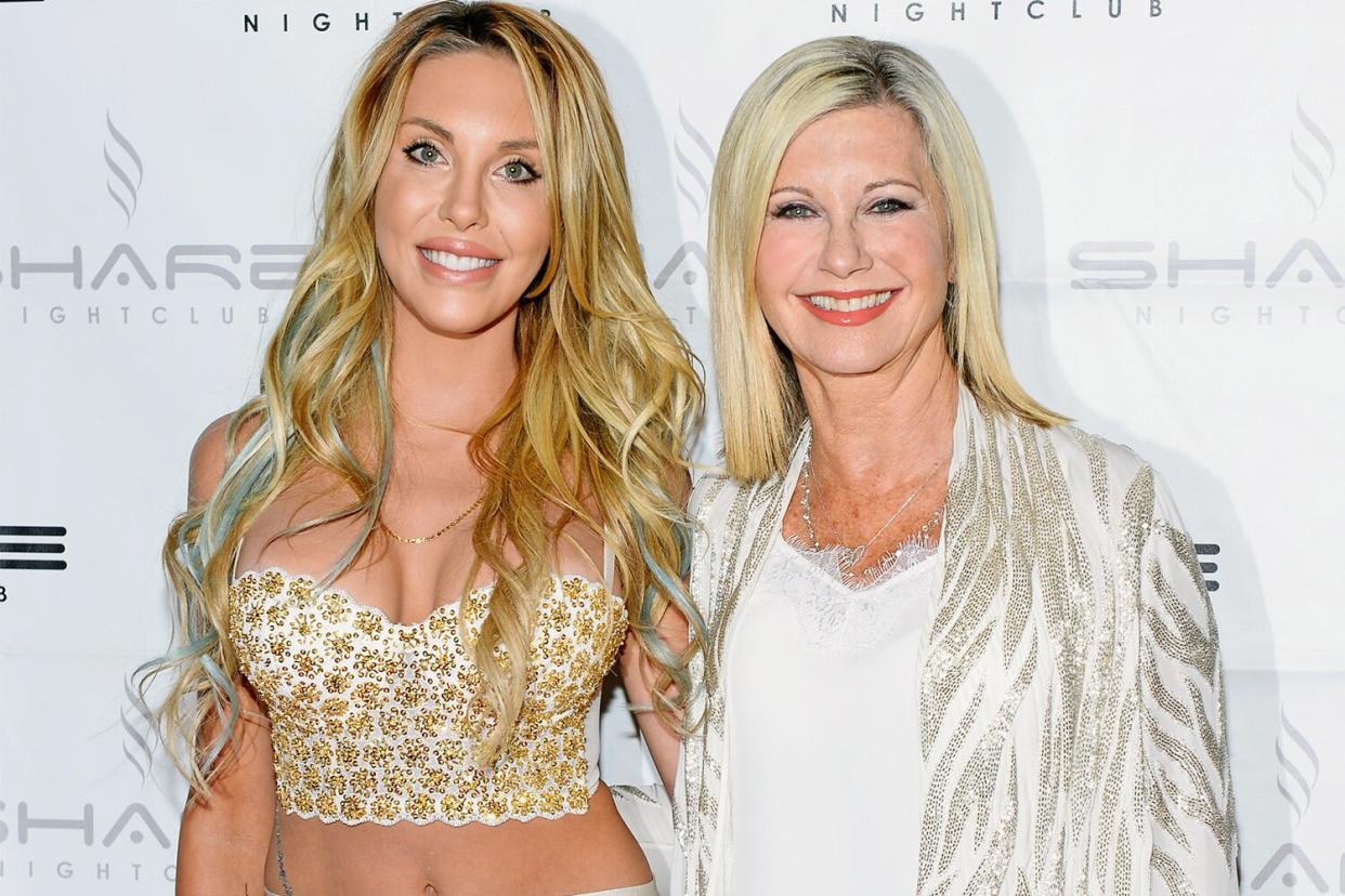 LAS VEGAS, NV - AUGUST 09: Singer Chloe Lattanzi (L) and her mother, singer/actress Olivia Newton-John celebrate the 35th anniversary of "Xanadu" with the world premiere of their music video "You Have to Believe" at Share Nightclub on August 9, 2015 in Las Vegas, Nevada. (Photo by Bryan Steffy/WireImage)