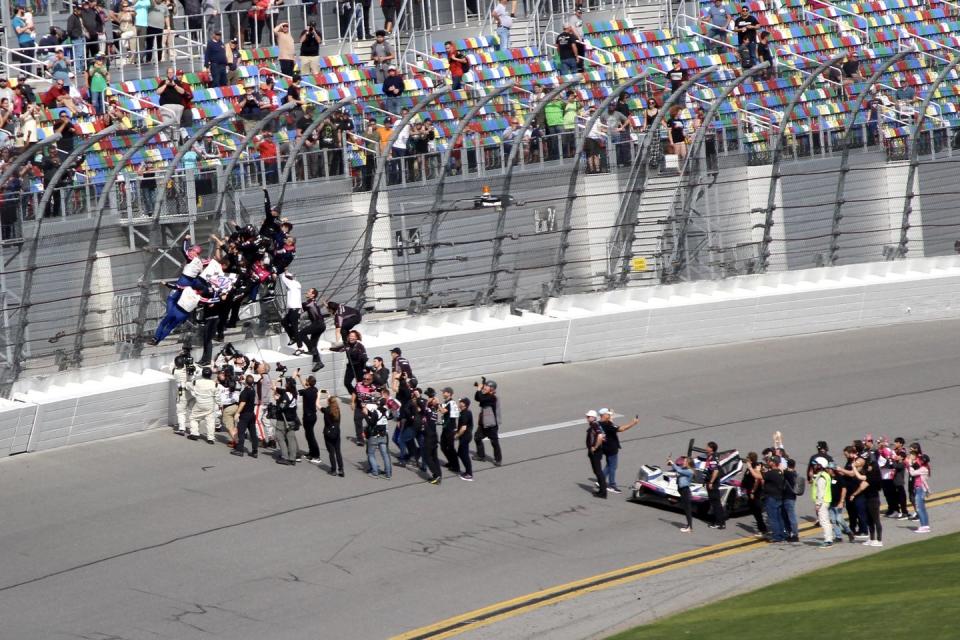 the no 60 acura team celebrates their victory