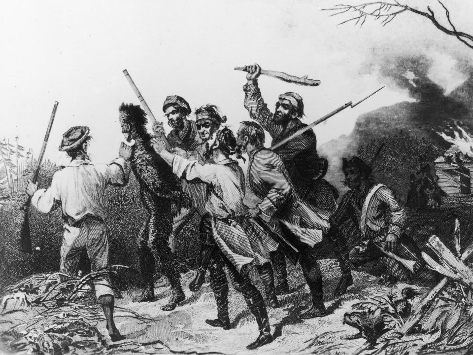 Men wave guns and weapons during the Whisky REbellion in the late 1700s.