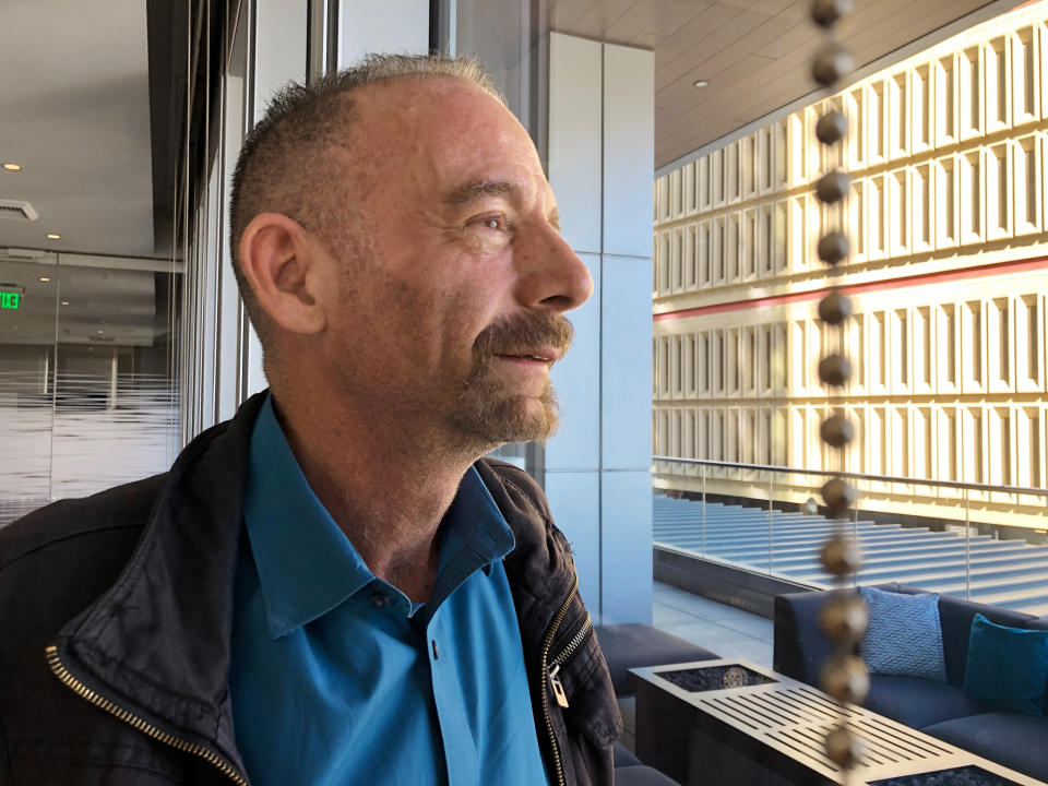 FILE - This March 4, 2019, file photo shows Timothy Ray Brown, nicknamed the Berlin patient, posed in Seattle. A Brazilian man who was infected with the AIDS virus has shown no sign of it for more than a year since he stopped HIV medicines after an intense drug therapy aimed at purging hidden, dormant virus from his body, doctors are reporting. If confirmed, this would be the first time HIV has been eliminated without a bone marrow or stem cell transplant like the ones that have cured two other men, nicknamed the Berlin and London patients for where they were treated. (AP Photo/Manuel Valdes, File)