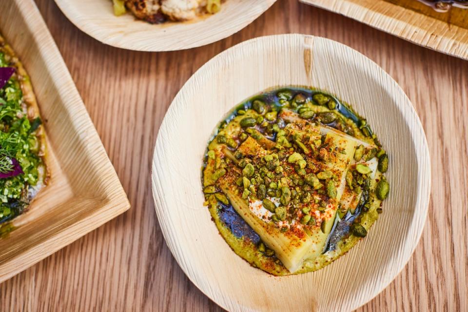 Acme Fire Cult’s Coal Roasted Leeks with Pistachio Romesco (Acme Fire Cult)