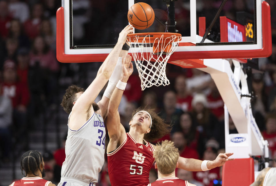 Northwestern's Matthew Nicholson (34) shoots over Nebraska's Josiah Allick (53) during the first half of an NCAA college basketball game Saturday, Jan. 20, 2024, in Lincoln, Neb. (AP Photo/Rebecca S. Gratz)