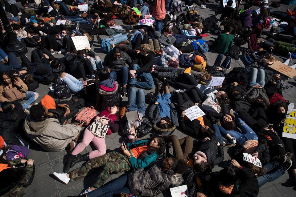 Student activists participate in a 'die-in' to protest gun violence near the campus of New York University on April 20, 2018, the anniversary of the 1999 mass shooting at Columbine High School in Colorado.