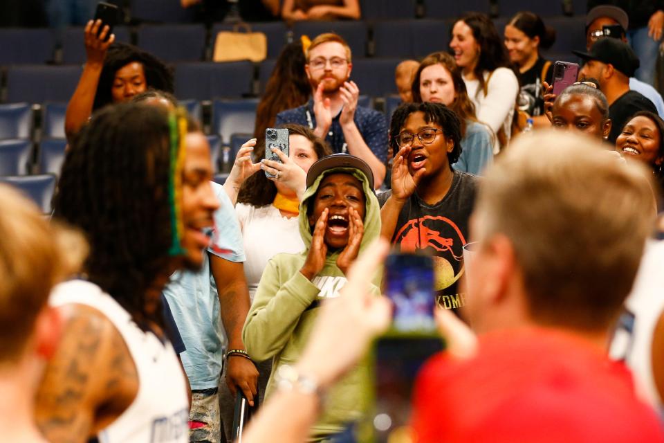 Fans react as Grizzlies' Ja Morant (12) walks off the court after the game between the Memphis Grizzlies and Portland Trail Blazers at FedExForum in Memphis, Tenn., on April 4, 2023.