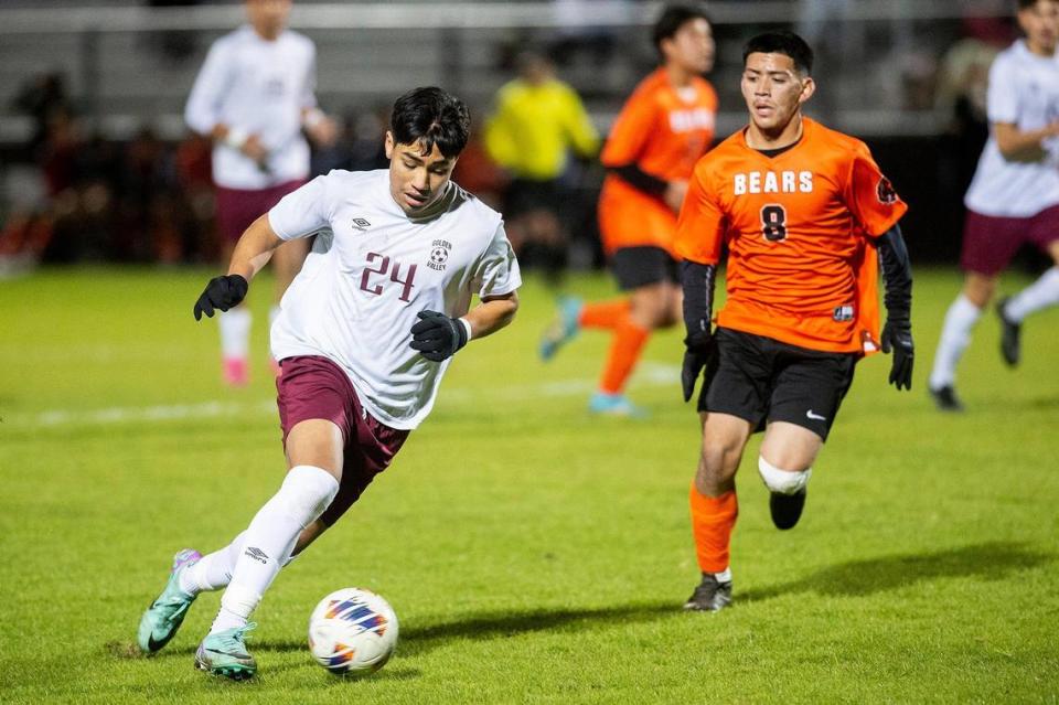 Golden Valley junior Jose Ontiveros (24) dribbles upfield during a game against Merced at Merced High School in Merced, Calif., on Thursday, Jan. 11, 2024. The Cougars beat the Bears 3-1.