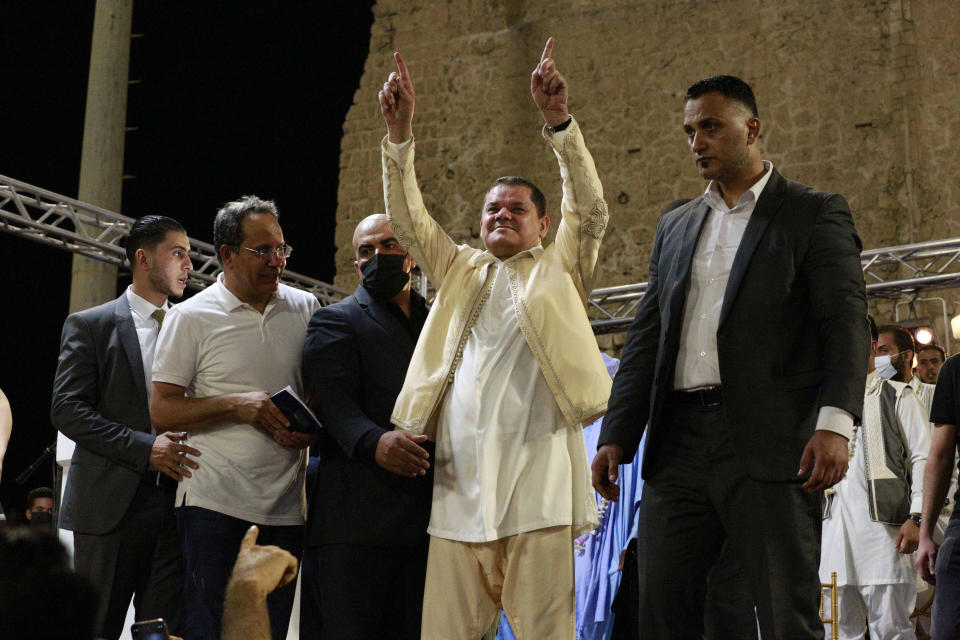 Interim Prime Minister of Libya Abdul Hamid Dbeibah addresses supporters at a protest calling for the country’s parliament to step down, on Friday, Sept. 24, 2021, in Tripoli, after it passed a vote of no-confidence in Dbeibah’s transitional government. The motion, passed on Tuesday, represents a challenge to planned December elections and impedes efforts to unite the oil-rich North African nation after a decade of turmoil. (AP Photo/Yousef Murad)