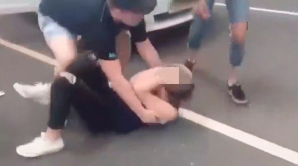 A girl was knocked to the ground during the car park brawl. Source: Facebook/Ray Hadley Morning Show