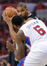 LOS ANGELES, CA - MAY 20: Tim Duncan #21 of the San Antonio Spurs looks to drive on DeAndre Jordan #6 of the Los Angeles Clippers in the first quarter in Game Four of the Western Conference Semifinals in the 2012 NBA Playoffs on May 20, 2011 at Staples Center in Los Angeles, California. NOTE TO USER: User expressly acknowledges and agrees that, by downloading and or using this photograph, User is consenting to the terms and conditions of the Getty Images License Agreement. (Photo by Harry How/Getty Images)