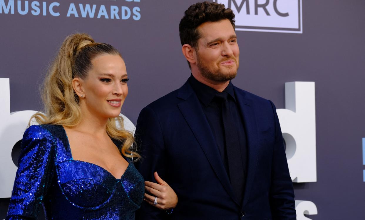 Canadian singer Michael Buble and his wife Argentine actress Luisana Lopilato attend the 2022 Billboard Music Awards at the MGM Grand Garden Arena in Las Vegas, Nevada, May 15, 2022. (Photo by Maria Alejandra CARDONA / AFP) (Photo by MARIA ALEJANDRA CARDONA/AFP via Getty Images)