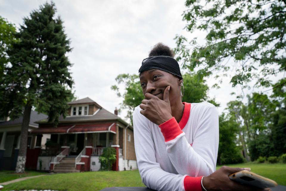 Detroit resident Nakeisha Thompson, 49, is happy that Benta Dixon, Detroit code enforcement specialist, and her team are out in her neighborhood on Wednesday, July 17, 2024, helping owners of junk that may not legally be left abandoned or unregistered and in disrepair in their driveways and lawns.