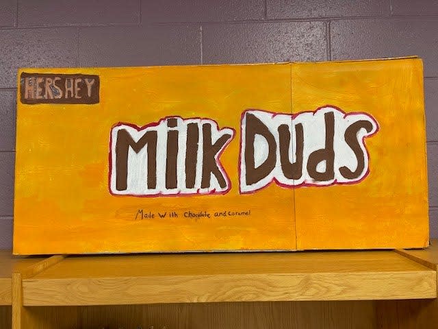 Artwork created by Amelia and Amelia, eighth-grade students at Denmark Middle School in Denmark, Wisconsin in fall 2023. Students chose their favorite snack or candy and created a giant lifesize version using butcher block paper, paint and newspaper based on work by artist Claes Oldenburg.