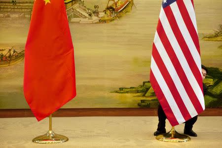 FILE PHOTO - A U.S. flag is tweaked ahead of a news conference between U.S. Secretary of State John Kerry and Chinese Foreign Minister Wang Yi at the Ministry of Foreign Affairs in Beijing, Wednesday, Jan. 27, 2016. REUTERS/Jacquelyn Martin/Pool