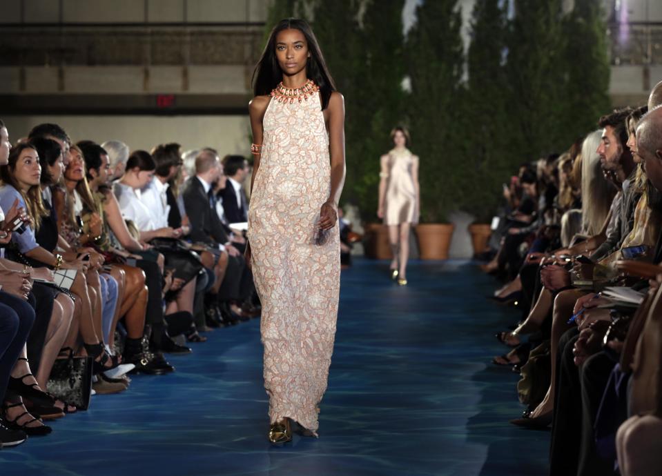 The Tory Burch Spring 2014 collection is modeled during Fashion Week in New York, Tuesday, Sept. 10, 2013. (AP Photo/Richard Drew)