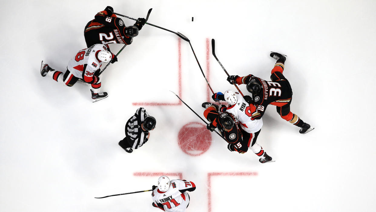 ANAHEIM, CALIFORNIA - MARCH 10:  Jani Hakanpaa #28, Jakob Silfverberg #33 and Ryan Getzlaf #15 of the Anaheim Ducks battle Bobby Ryan #9 , Chris Tierney #71 and Rudolfs Balcers #38 of the Ottawa Senators during the third period of a game at Honda Center on March 10, 2020 in Anaheim, California. (Sean M. Haffey/Getty Images)