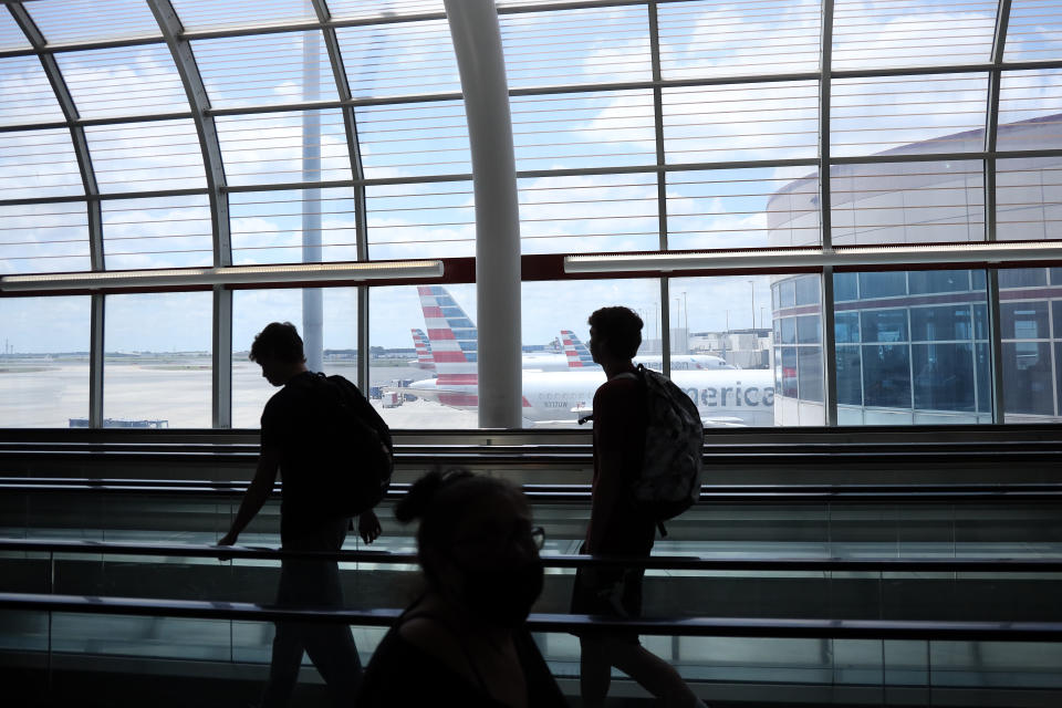 Passengers walk between terminals at Charlotte Douglas International Airport on May 15, 2020 in Charlotte, North Carolina. (Chris Graythen/Getty Images)