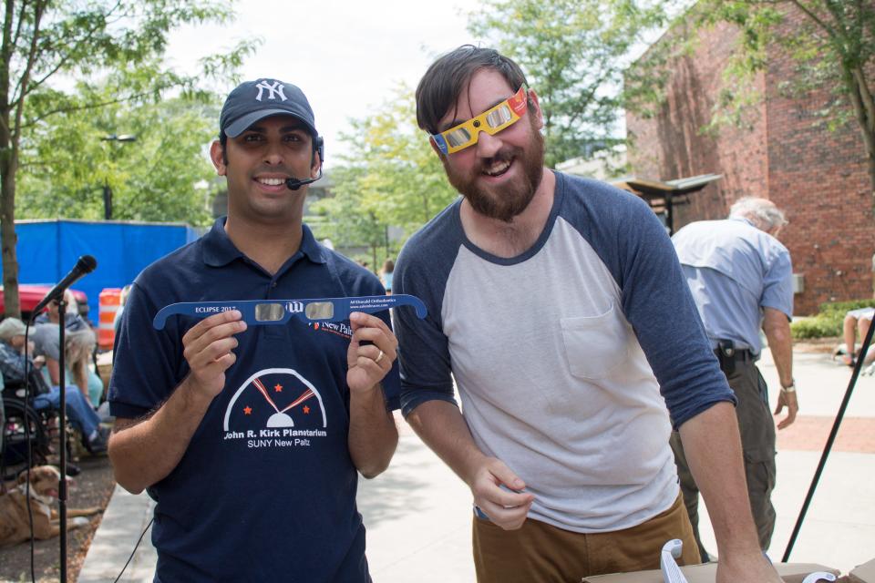 Raj Pandya, astronomy lecturer and director of the John R. Kirk Planetarium at SUNY New Paltz, with participants at his solar eclipse viewing event on Aug. 21, 2017. Pandya is preparing to host another solar eclipse viewing event on April 8.