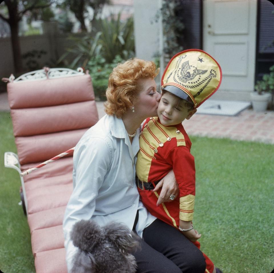 1957: A candid moment with her son Desi Jr. in the backyard of their Los Angeles home.