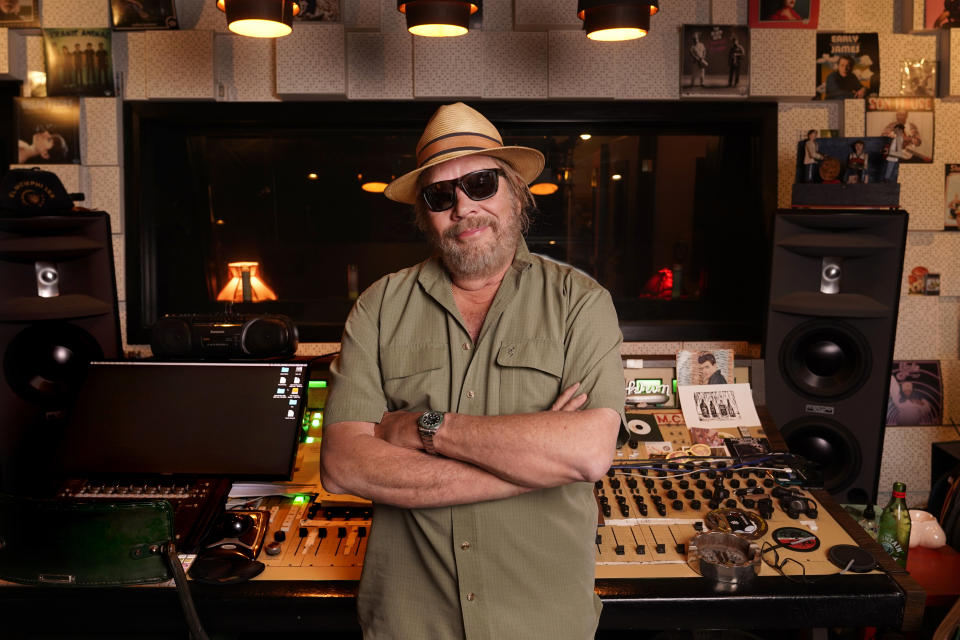 Hank Williams Jr. poses in a recording studio on June 6, 2022, in Nashville, Tenn., to promote his new album "Rich White Honky Blues," under his alter ego Thunderhead Hawkins. The album shows the Country Music Hall of Famer's early influences from blues that later helped him develop his blue-collar Southern country rock sound. (AP Photo/Mark Humphrey)