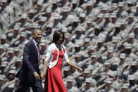 <p>President Barack Obama and first lady Michelle are saluted by soldiers as they arrive at the Fort Stewart Army post, April 27, 2012, in Fort Stewart, Ga. (AP Photo/David Goldman) </p>