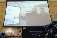 FILE - A exhibit of a photo of former President Donald Trump backstage before he spoke at the Jan. 6 rally, is displayed as Cassidy Hutchinson, former aide to Trump White House chief of staff Mark Meadows, testifies as the House select committee investigating the Jan. 6 attack on the U.S. Capitol holds a hearing at the Capitol in Washington, June 28, 2022. The Jan. 6 congressional hearings have paused, at least for now, and Washington is taking stock of what was learned about the actions of Donald Trump and associates surrounding the Capitol attack.(AP Photo/Jacquelyn Martin, File)