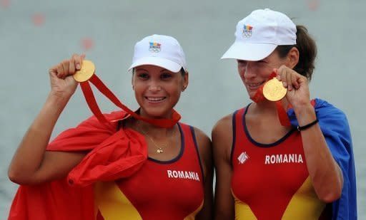 Romania's Georgeta Andrunache and Viorica Susanu celebrate after winning gold at the 2008 Beijing Olympics. The Romanian pair are seeking their fourth successive Olympic gold in the coxless pairs