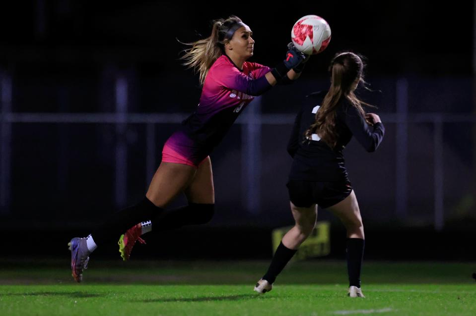 Atlantic Coast goalkeeper Gaby Rourke (15) punches the ball away from the net during double overtime of a Gateway Conference semifinal at Fletcher.