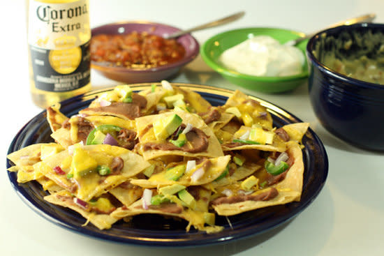 <strong>Get the <a href="http://www.macheesmo.com/2009/02/near-perfect-nachos/">Near Perfect Nachos recipe from Macheesmo</a></strong>  We have complex feelings about individually-topped nachos, but we trust Macheesmo implicitly. 