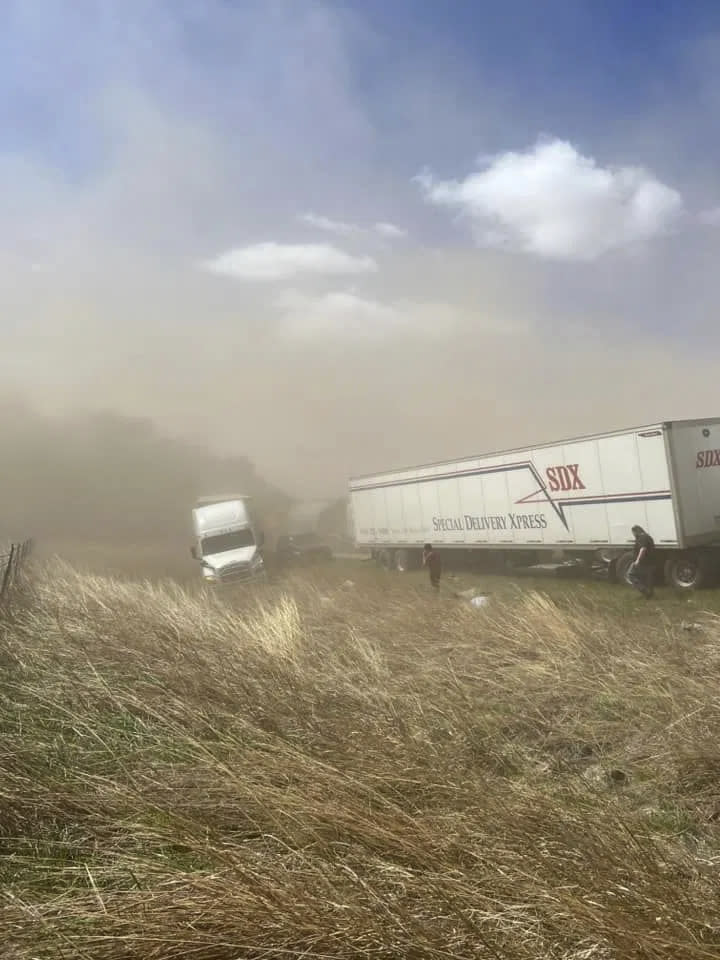 A crash involving at least 20 vehicles shut down a highway in Illinois, Monday, May 1, 2023. Illinois State Police say a windstorm that kicked up clouds of dust in south-central Illinois led to numerous crashes and multiple fatalities on Interstate 55. (WICS TV via AP)