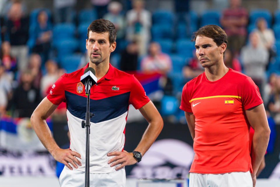 Novak Djokovic talks while Rafael Nadal looks on during the trophy presentation ceremony  during day 10 of the ATP Cup at Ken Rosewall Arena on January 12, 2020 in Sydney, Australia.