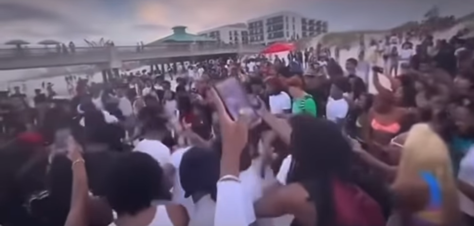 This video image shows a crowd of up to 400 people at Jacksonville Beach participating in competitions and drinking that led to the first of three shootings on St. Patrick's Day, one deadly.