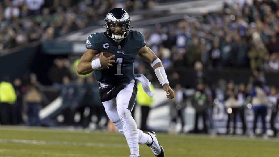 Philadelphia Eagles' Jalen Hurts running with football