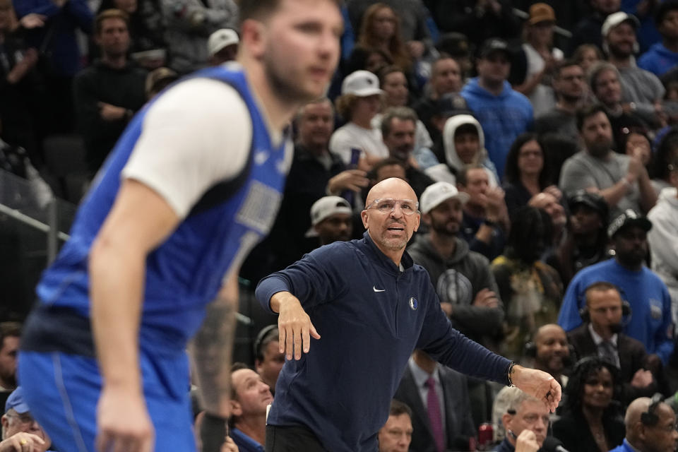 Dallas Mavericks head coach Jason Kidd, right, looks towards guard Luka Doncic during the second half of an NBA basketball game against the Oklahoma City Thunder in Dallas, Saturday, Dec. 2, 2023. (AP Photo/LM Otero)