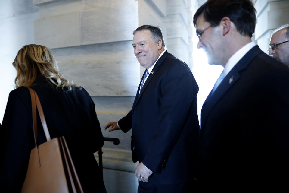 Secretary of State Mike Pompeo, center, walks with Defense Secretary Mark Esper, right, as they leave the Capitol after briefing Senators on the details of the threat that prompted the U.S. targeted killing of Iranian Gen. Qassem Soleiman in Iraq, Wednesday, Jan. 8, 2020 on Capitol Hill in Washington. (AP Photo/ Jacquelyn Martin)
