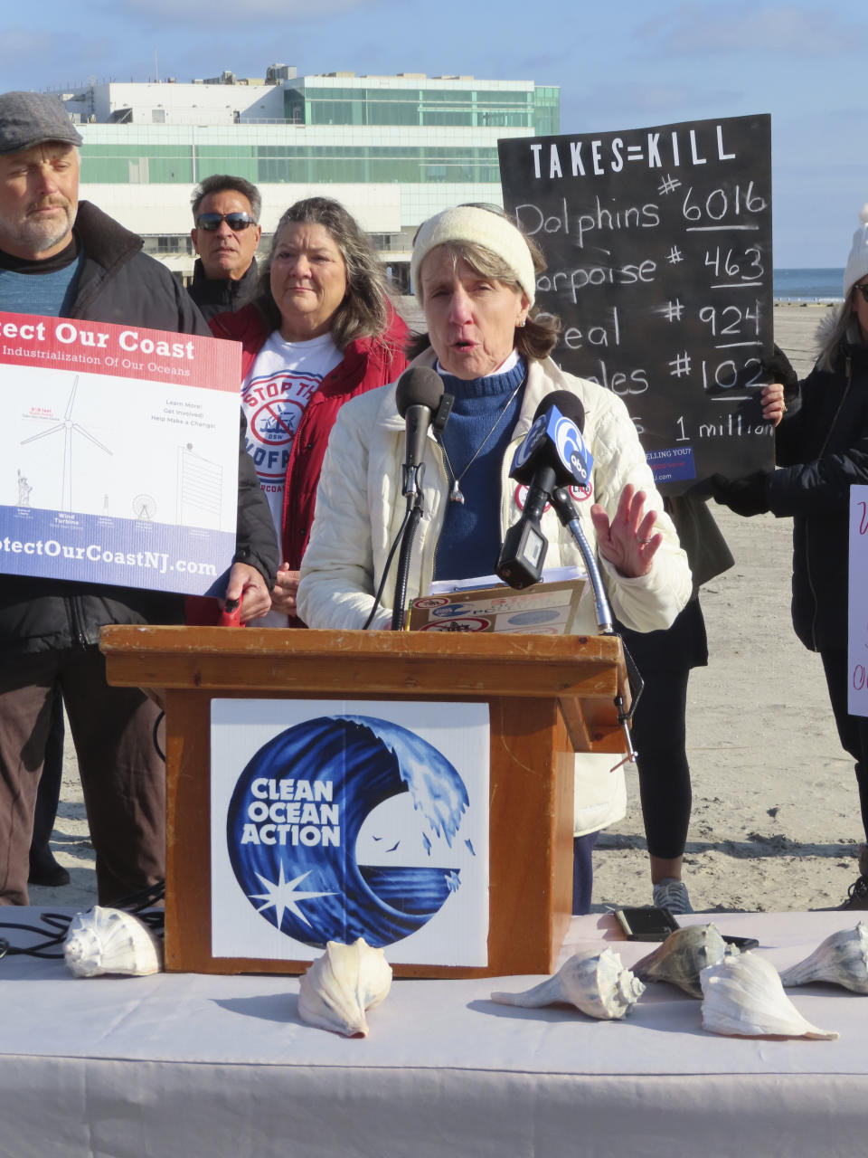 Cindy Zipf, executive director of the Clean Ocean Action environmental group, speaks at a press conference on the beach in Atlantic City, N.J., on Monday, Jan. 9, 2023, where a large dead whale was buried over the weekend. Several groups called for a federal investigation into the deaths of six whales that have washed ashore in New Jersey and New York over the past 33 days and whether the deaths were related to site preparation work for the offshore wind industry. (AP Photo/Wayne Parry)
