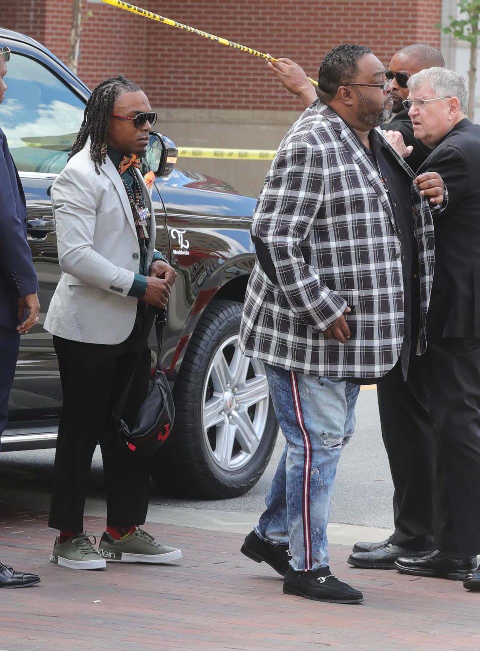 Michael Harris, left, and Jacob Blake Sr. arrive Wednesday for the calling hours and funeral of Jayland Walker at Akron Civic Theatre. Harris was beaten and arrested by Akron police while protesting the police shooting of Walker. Blake is the father of Jacob Blake Jr., who was paralyzed by police in Kenosha, Wisconsin, in 2020.