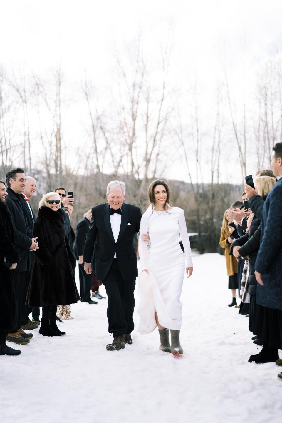 My father walking me down the aisle and making sure I don’t fall down on the way to the altar. Peter is 6’4” and I am 5’6”—I would have never thought that I would “walk down the aisle” in flat felted wool boots, but here I am. I don’t think I felt elegant until I slipped into my gray velvet Manolos just prior to the start of the reception. Nonetheless, I loved this meadow and the afternoon light we got for the ceremony; it was beautiful.