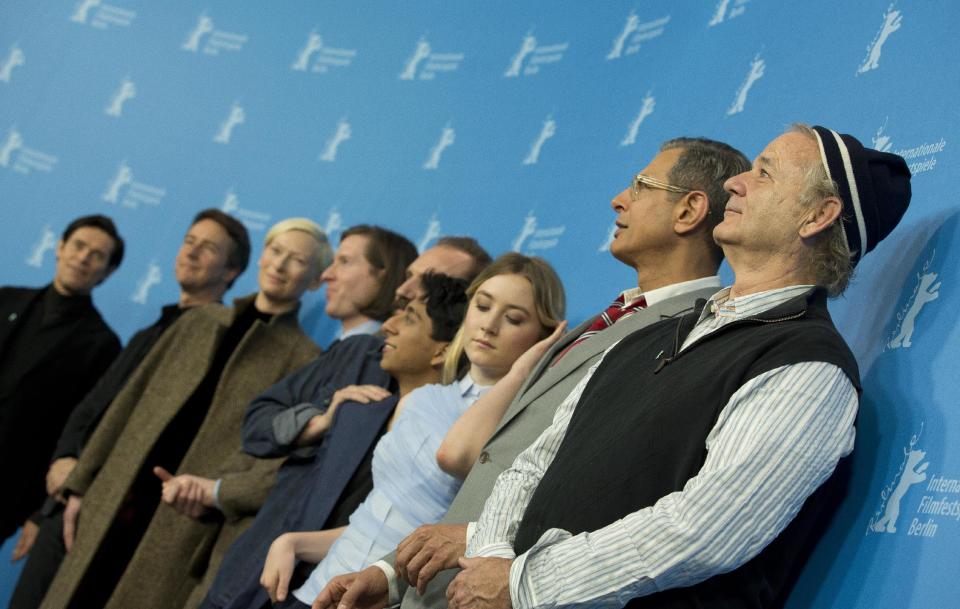 From left, actors Willem Dafoe, Ralph Fiennes, Tilda Swinton, director Wes Anderson, actors Ralph Fiennes, Tony Revolori, Saoirse Ronan, Jeff Goldblum and Bill Murray pose for photographers at the photo call for the film The Grand Budapest Hotel during the 64th Berlinale International Film Festival on Thursday Feb. 6, 2014, in Berlin. (AP Photo/Axel Schmidt)