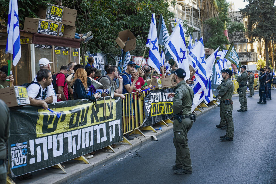 Israelis protest against plans by Prime Minister Benjamin Netanyahu's government to overhaul the judicial system and in support of the Supreme Court ahead of Thursday's pivotal hearing, in Jerusalem, Thursday, Sept. 28, 2023. The hearing over a law that makes it more difficult to remove Netanyahu from office deepens a rift between the government and the judiciary amid months of turmoil in Israel. (AP Photo/Ohad Zwigenberg)